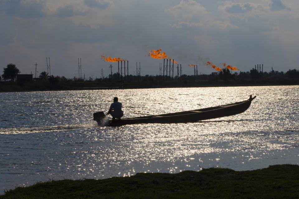 A man near the Nihran Bin Omar oil field north of Basra, Iraq, Wednesday, March 22, 2023. In the wake of the US invasion of Iraq in 2003 and toppling of Saddam Hussein, foreign investors flocked to the country's abundant oil fields and contracts were doled out, filling Iraqi state coffers. The new constitution drafted in 2005 states that the country's oil wealth belongs to the Iraqi people. (AP Photo/Nabil al-Jurani)