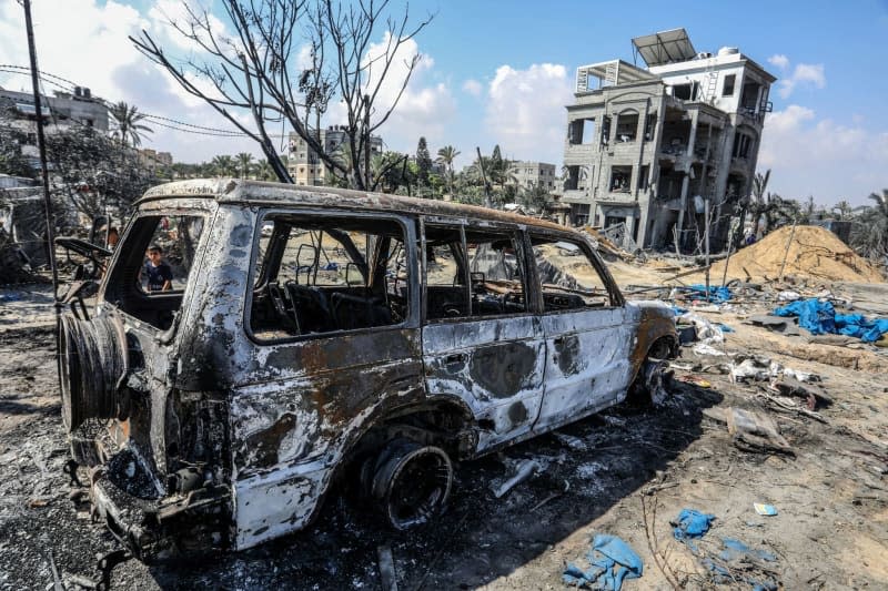 View of a damaged vehicle at the site of the Israeli bombing of Al-Mawasi camp the previous day, amid the ongoing conflict between Israel and Hamas.  Abed Rahim Khatib/dpa