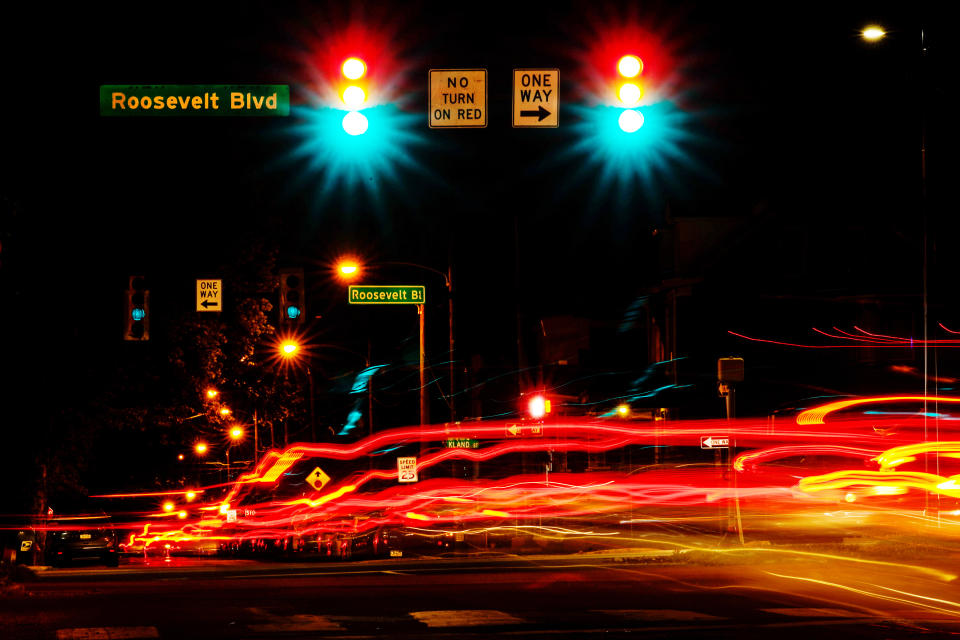 This long exposure photo shows traffic crossing Roosevelt Boulevard in Philadelphia, Wednesday, May 25, 2022. Roosevelt Boulevard is an almost 14-mile maze of chaotic traffic patterns that passes through some of the city's most diverse neighborhoods and Census tracts with the highest poverty rates. Driving can be dangerous with cars traversing between inner and outer lanes, but biking or walking on the boulevard can be even worse with some pedestrian crossings longer than a football field and taking four light cycles to cross. (AP Photo/Matt Rourke)