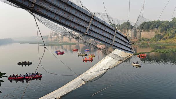 PHOTO: Indian rescue personnel conduct search operations on Oct. 31, 2022 after a bridge across the river Machchhu collapsed in Morbi on Oct. 30. (Sam Panthaky/AFP via Getty Images)