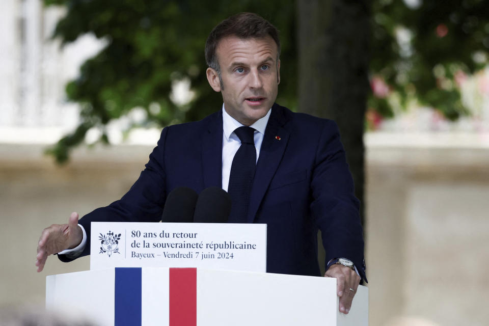 French President Emmanuel Macron speaks during a ceremony to commemorate the return of republican sovereignty, as part of the 80th anniversary of the 1944 D-Day landings, Normandy region, in Bayeux, Friday, June 7, 2024.(Benoit Tessier/Pool via AP)