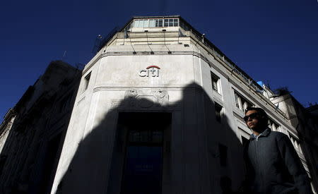 A woman walks past Citibank headquarters in Buenos Aires' financial district April 6, 2015. REUTERS/Marcos Brindicci