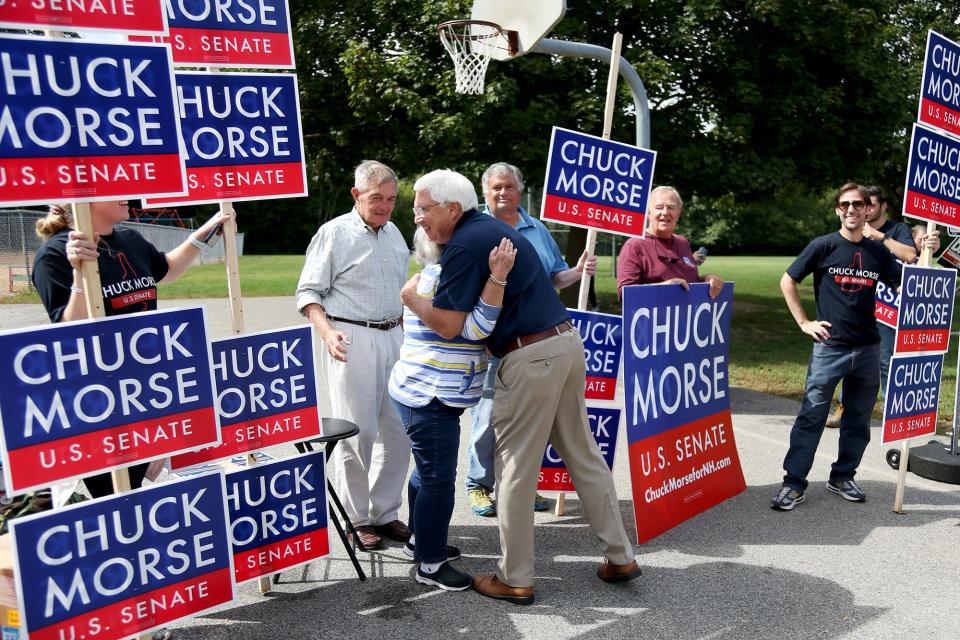 New Hampshire state Sen. Chuck Morse, a Republican candidate for U.S. Senate, greets supporters at Stratham Memorial School during primary voting Tuesday, Sept. 13, 2022.