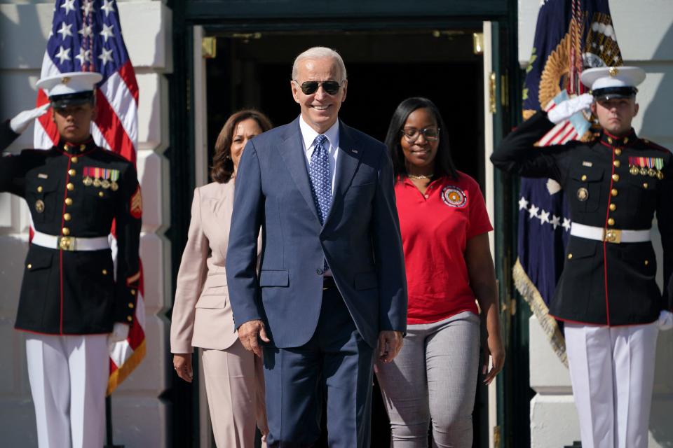 US President Joe Biden, Vice President Kamala Harris and Lovette Jacobs, a 5th year International Brotherhood of Electrical Workers Local 103 electrical apprentice and member of the Electrical Workers Minority Caucus & Womens Caucus, arrive to speak during an event celebrating the passage of H.R. 5376, the Inflation Reduction Act of 2022, on the South Lawn of the White House in Washington, DC on September 13, 2022. (Photo by Mandel NGAN / AFP) (Photo by MANDEL NGAN/AFP via Getty Images)