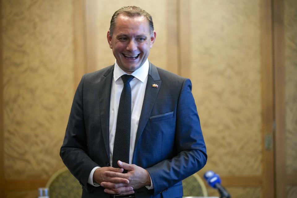 FILE - In this Thursday, June 24, 2021 file photo Germany's far-right 'Alternative for Germany' (AfD) spokesperson Tino Chrupalla smiles after a news conference in Moscow, Russia. Migration is a side issue in this year's German election campaign, but that hasn't stopped the country's biggest far-right party from trying to play it up. (AP Photo/Alexander Zemlianichenko)