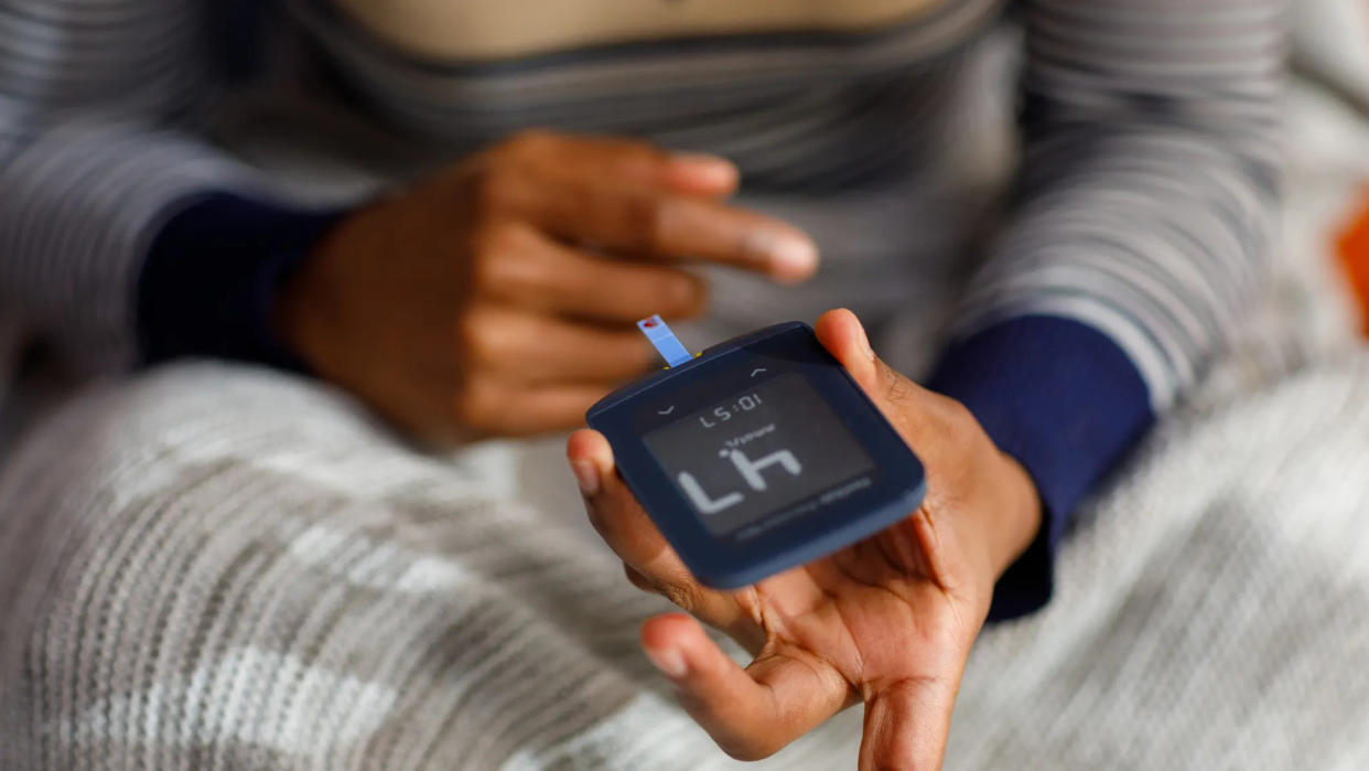 Woman checking blood sugar