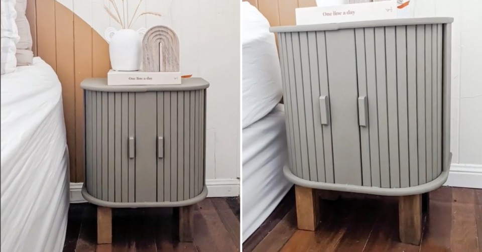 Two Kmart bread bins have been made into bedside tables by joining them on their bases, so the roller doors can still open. The set has been pained grey and raised on wooden legs and appears beside a bed with white linen.