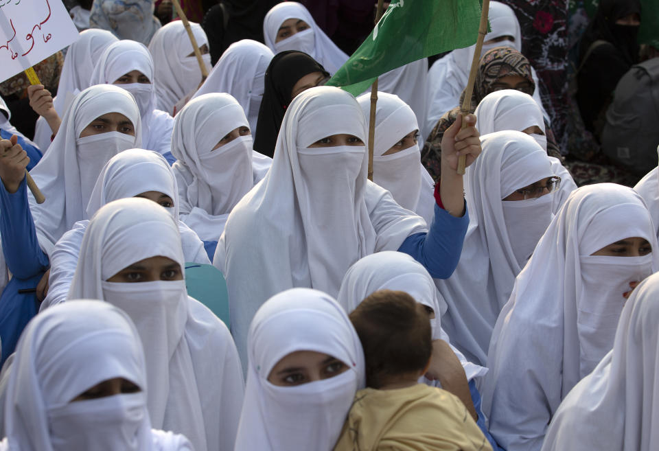 Supporters of Pakistani religious party Jamaat-e-Islami rally to express solidarity with Indian Kashmiris, in Islamabad, Pakistan, Wednesday, Oct. 16, 2019. Pakistani and Indian troops traded fire in the disputed Himalayan region of Kashmir on Wednesday, killing four civilians and wounding nearly a dozen others, officials from both sides said, as tensions remain high between the two South Asian countries. (AP Photo/B.K. Bangash)