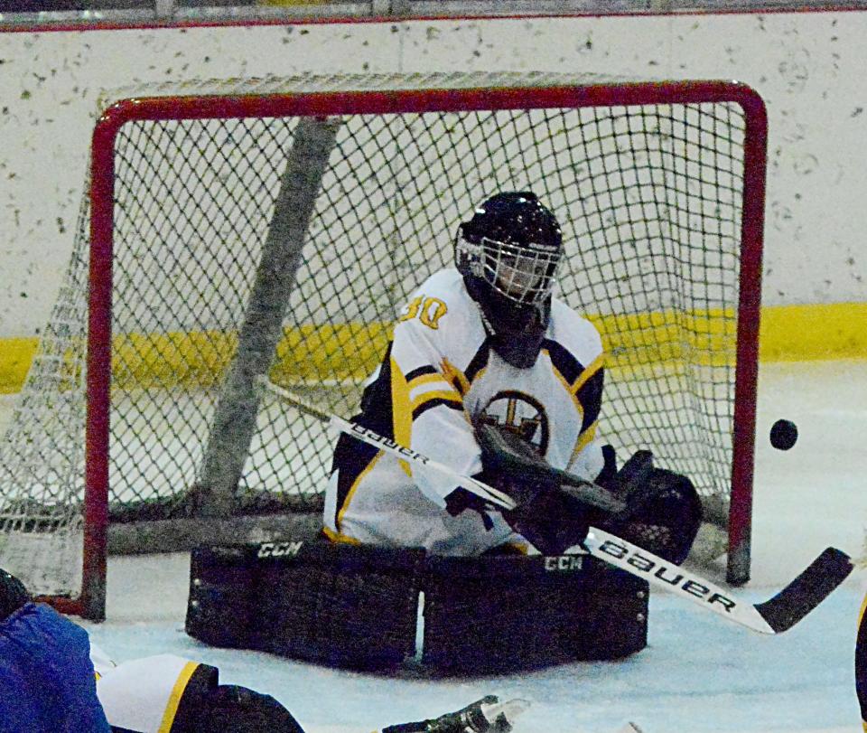 Watertown Lakers goalie Angelyn Birnell deflects a shot away from the goal during a South Dakota Amateur Hockey Association varsity girls game against Brookings on Saturday, Dec. 3, 2022 in the Maas Ice Arena.