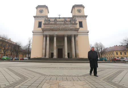 Miklos Beer, the bishop of Vac, walks in front of the cathedral in Vac, Hungary March 9, 2017. REUTERS/Laszlo Balogh