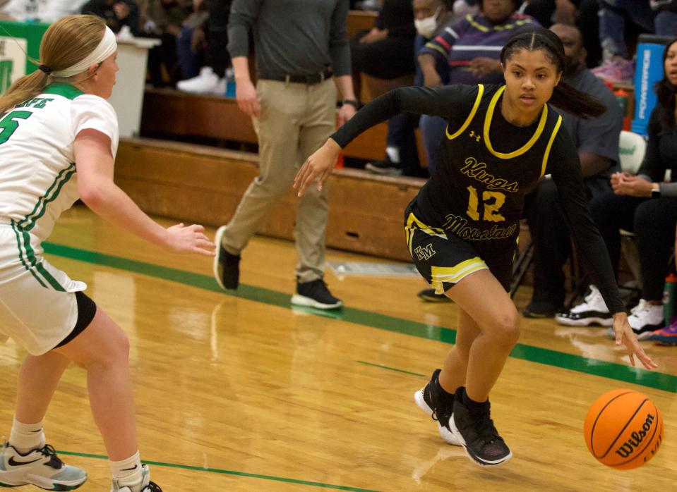 Kings Mountain's Khalia King dribbles past an Ashbrook defender during Friday's Big South 3A girls hoops matchup in Gastonia.