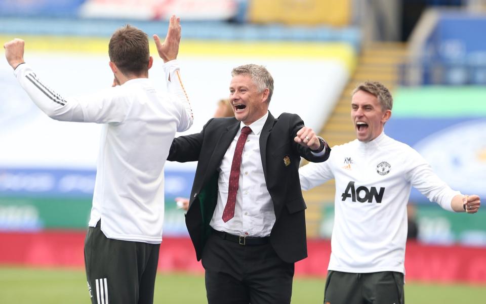 Kieran McKenna celebrates alongside Michael Carrick and Ole Gunnar Solskjaer last season. - GETTY IMAGES