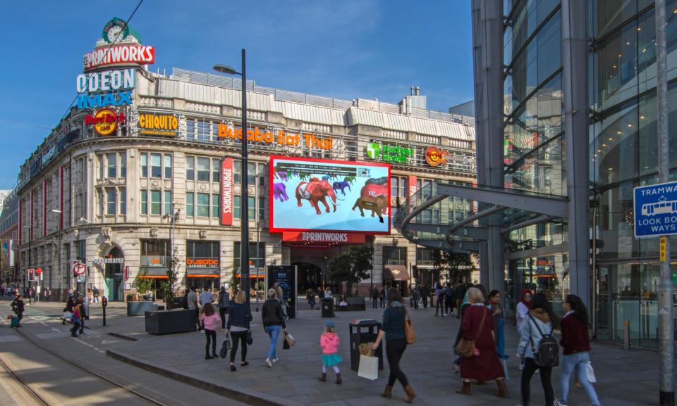 A digital elephant sponsored by The Independent appears on screen in Manchester