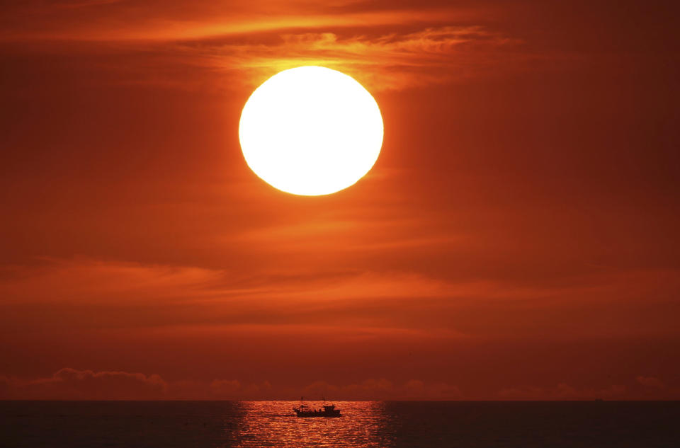 The sun rises at Cullercoats Bay on Engalnd’s north east coast, Thursday July 26, 2018 (Owen Humphreys/PA via AP)