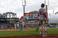 Washington Nationals' Adam Eaton, center, scores on a ground ball to third by Howie Kendrick as on-deck batter Anthony Rendon (6) watches in the first inning of a baseball game against the Pittsburgh Pirates, Thursday, Aug. 22, 2019, in Pittsburgh. (AP Photo/Keith Srakocic)