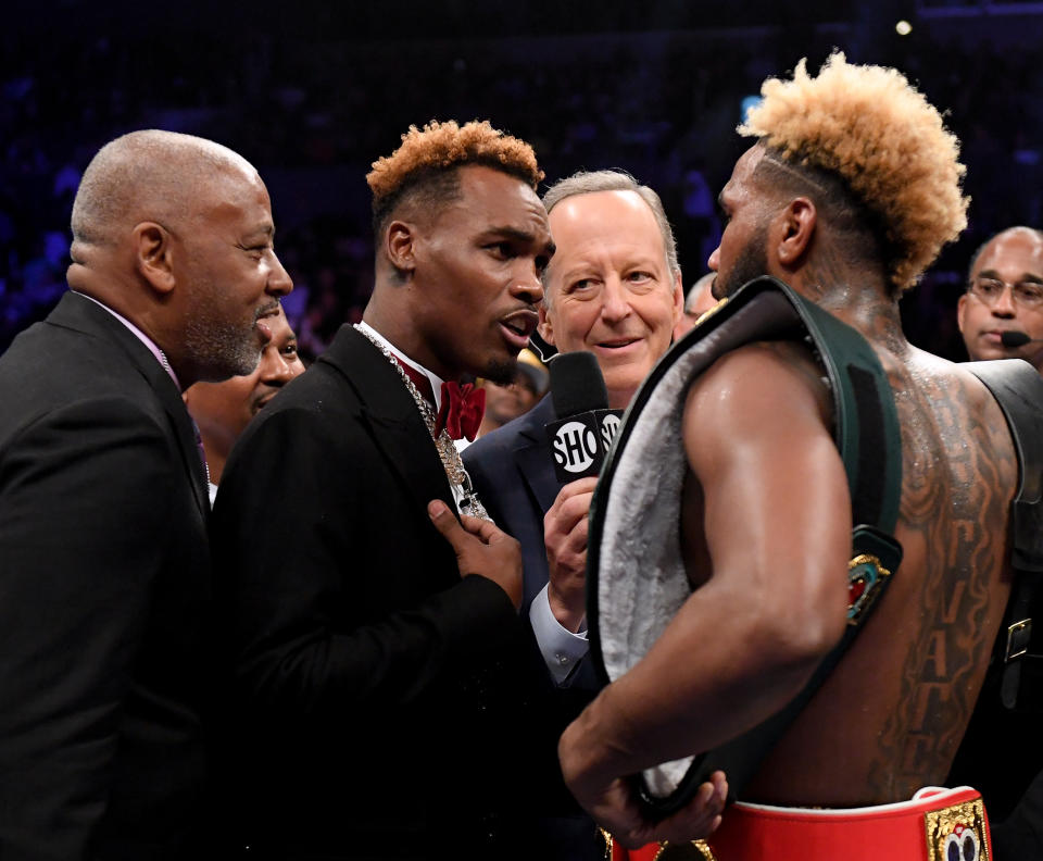 Jermall Charlo teases Jarrett Hurd (R) after his third round KO of Jason Welborn during the WBA-IBF-IBO junior middleweight championship on Dec. 1, 2018 in Los Angeles. (Harry How/Getty Images)