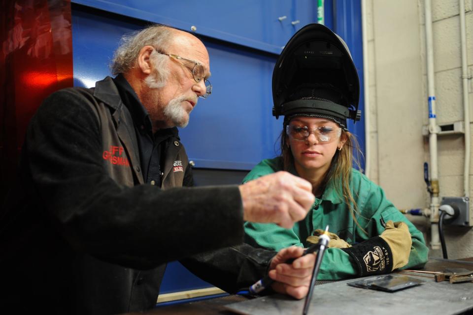 Wilson Talent Center welding teacher Jeff Grossman, 74, works with junior welding student Dakota Barnett at a TIG welding station, Thursday, April 4, 2024. After 50 years of teaching, Grossman will retire at the end of the year.