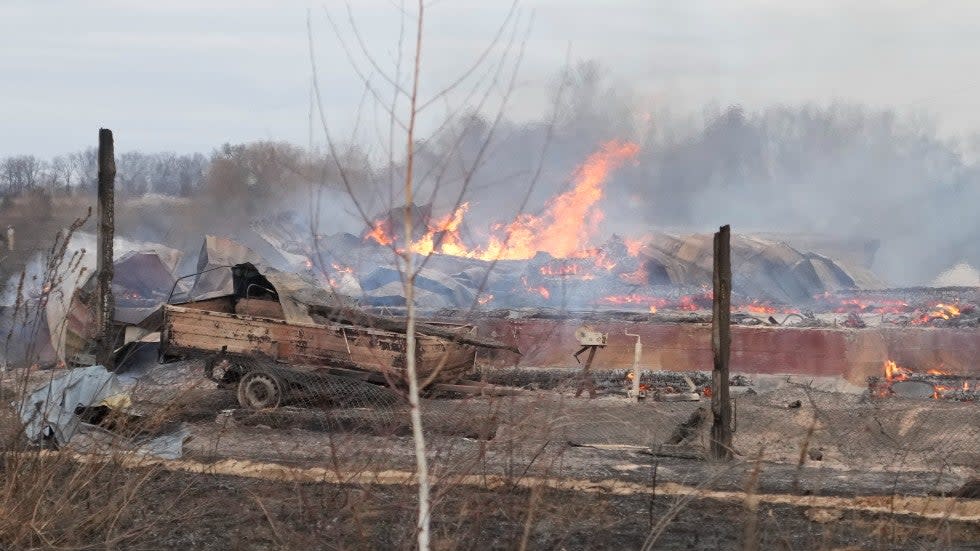 Flame and smoke rise from the debris of a privet house in the aftermath of Russian shelling outside Kyiv, Ukraine