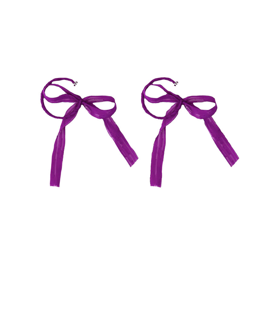 <p>Purple Wrapped Hoop Earrings, $55, <a rel="nofollow noopener" href="https://thefrankieshop.com/collections/accessories/products/purple-wrapped-hoop-earrings" target="_blank" data-ylk="slk:thefrankieshop.com;elm:context_link;itc:0;sec:content-canvas" class="link ">thefrankieshop.com</a> </p>