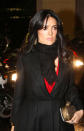 Salma Hayek donned a black coat and red gown for the Giambattista Valli show © Rex