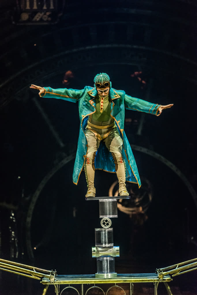 A balancing act with a rola bola board and cylinders in Kurios: Cabinet of Curiosities. (Photo: Martin Girard)