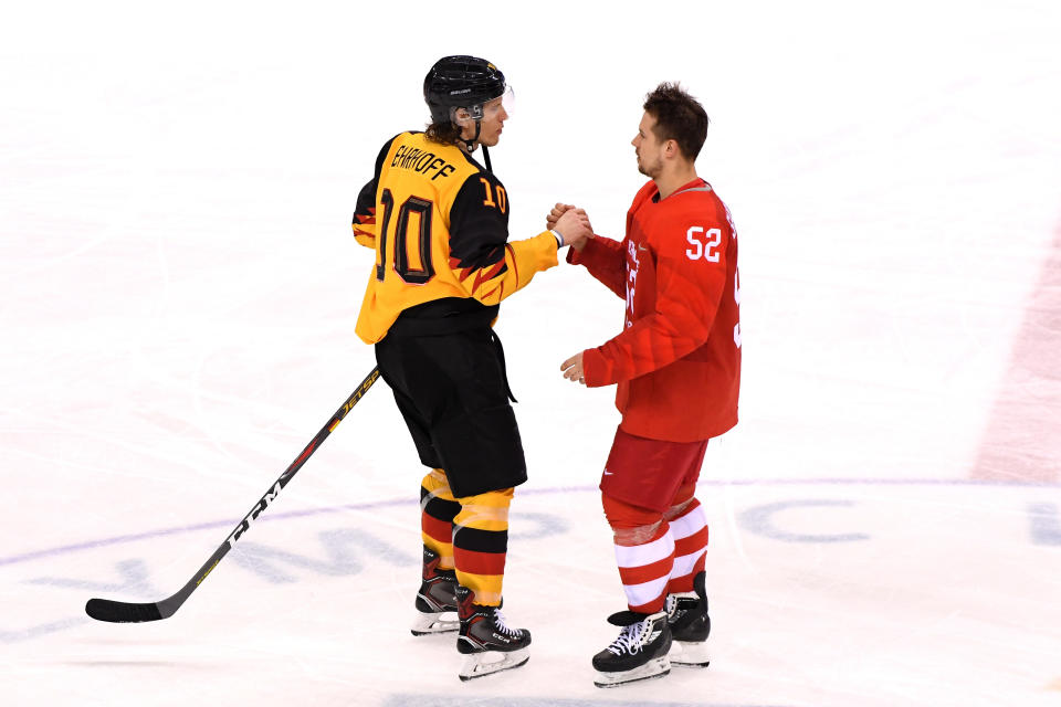 <p>Christian Ehrhoff #10 of Germany and Sergei Shirokov #52 of Olympic Athlete from Russia shake hands after the Men’s Gold Medal Game on day sixteen of the PyeongChang 2018 Winter Olympic Games at Gangneung Hockey Centre on February 25, 2018 in Gangneung, South Korea. Olympic Athletes from Russia defeated Germany 4-3 in overtime. (Photo by Harry How/Getty Images) </p>