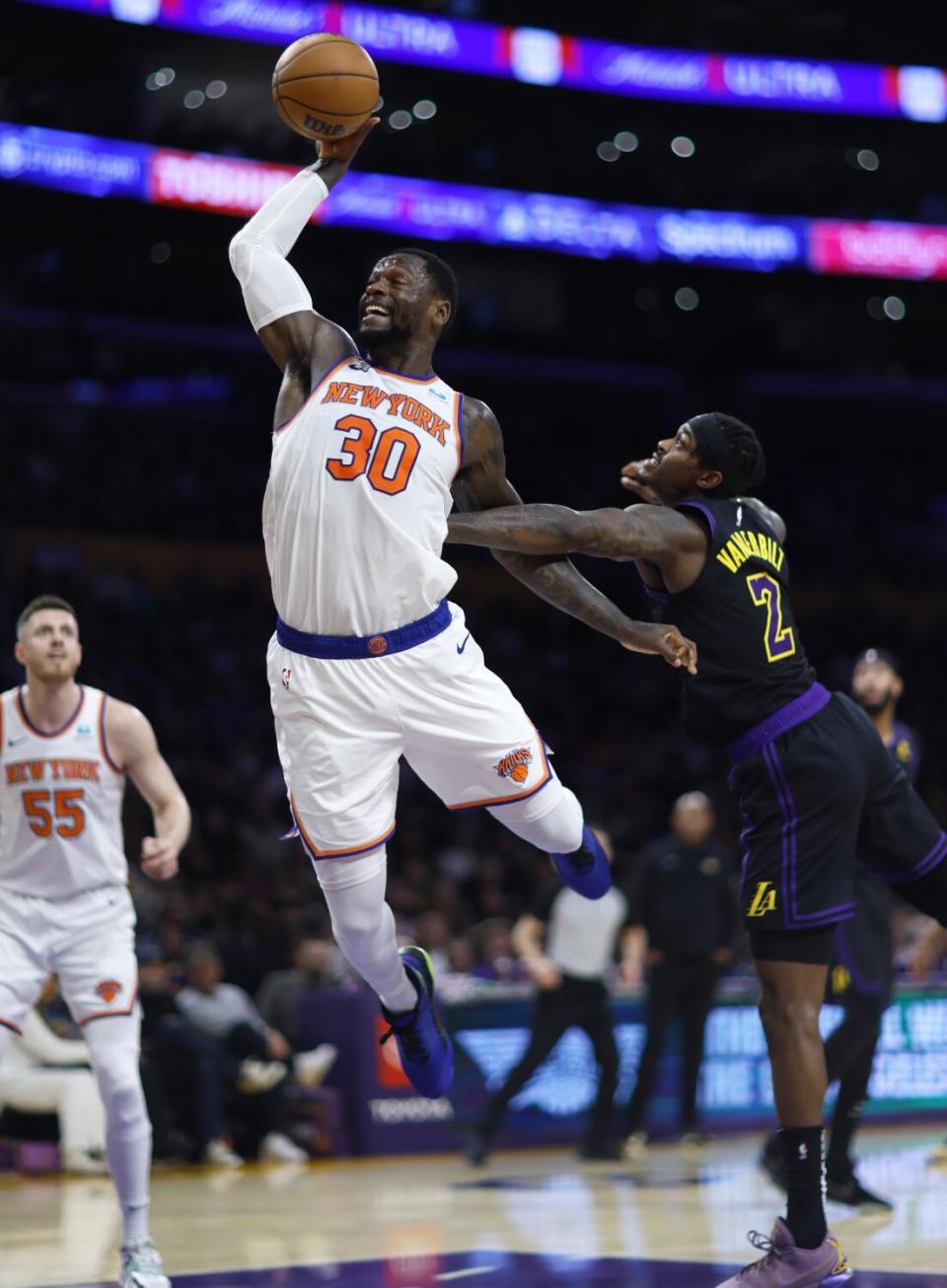 Julius Randle is fouled by Jarred Vanderbilt.