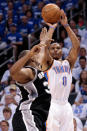 OKLAHOMA CITY, OK - JUNE 02: Russell Westbrook #0 of the Oklahoma City Thunder shoots the ball over Boris Diaw #33 of the San Antonio Spurs in the first quarter in Game Four of the Western Conference Finals of the 2012 NBA Playoffs at Chesapeake Energy Arena on June 2, 2012 in Oklahoma City, Oklahoma. NOTE TO USER: User expressly acknowledges and agrees that, by downloading and or using this photograph, User is consenting to the terms and conditions of the Getty Images License Agreement. (Photo by Brett Deering/Getty Images)