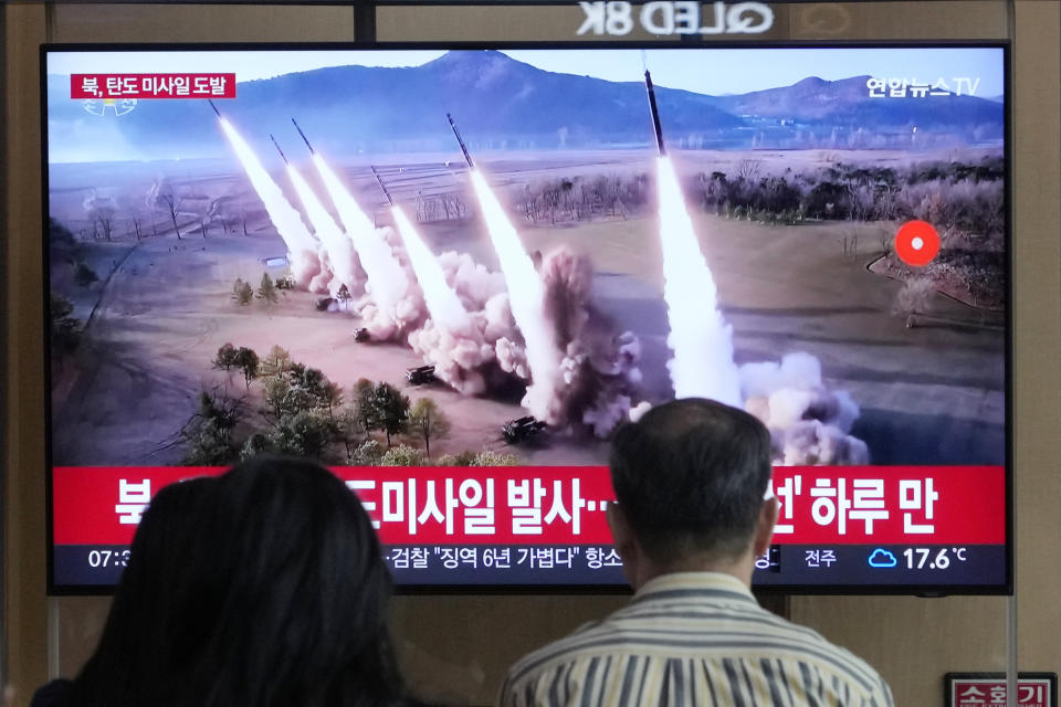 People watch a news program broadcasting a file image of a missile launch by North Korea, at the Seoul Railway Station in Seoul, South Korea, Thursday, May 30, 2024. North Korea on Thursday fired a barrage of ballistic missiles toward its eastern sea, according to South Korea's military, days after its attempt to launch a military reconnaissance satellite ended in failure but still drew strong condemnation from its rivals. (AP Photo/Ahn Young-joon)