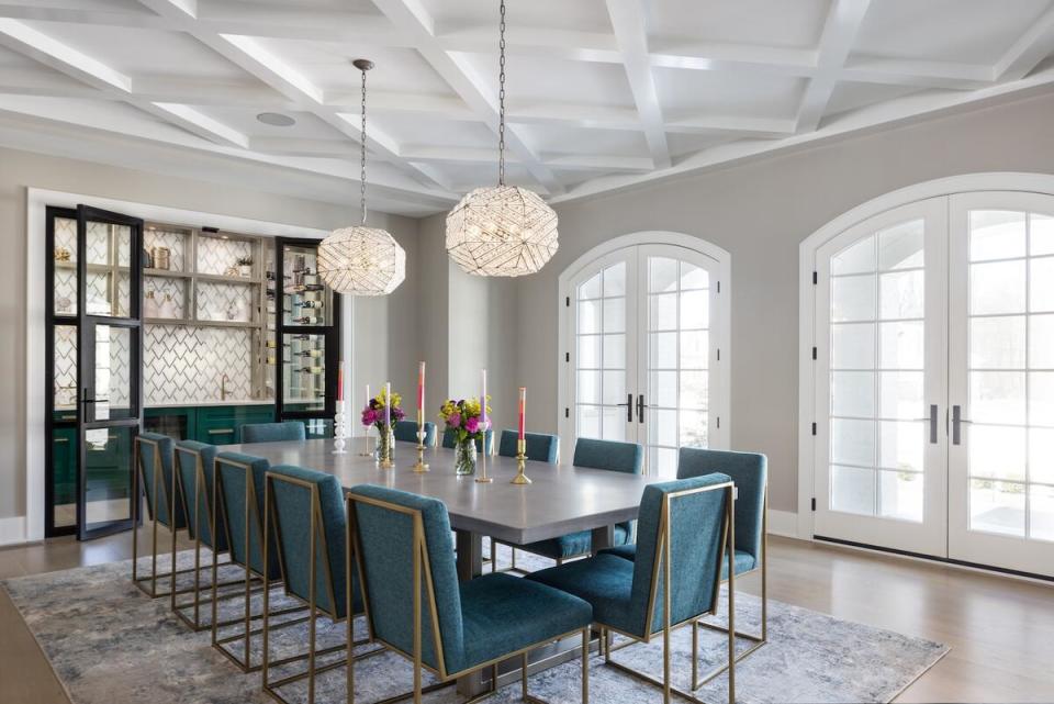 A chic wet bar opens into the dining room