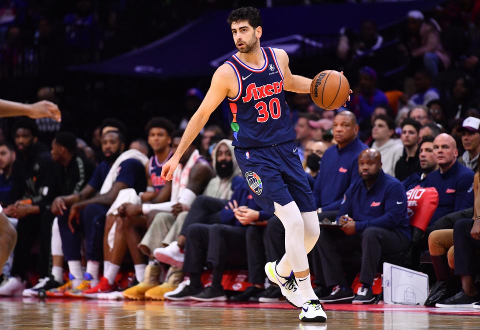 Philadelphia 76ers guard Furkan Korkmaz (30) controls the ball against the Detroit Pistons during a 2022 game at Wells Fargo Center.