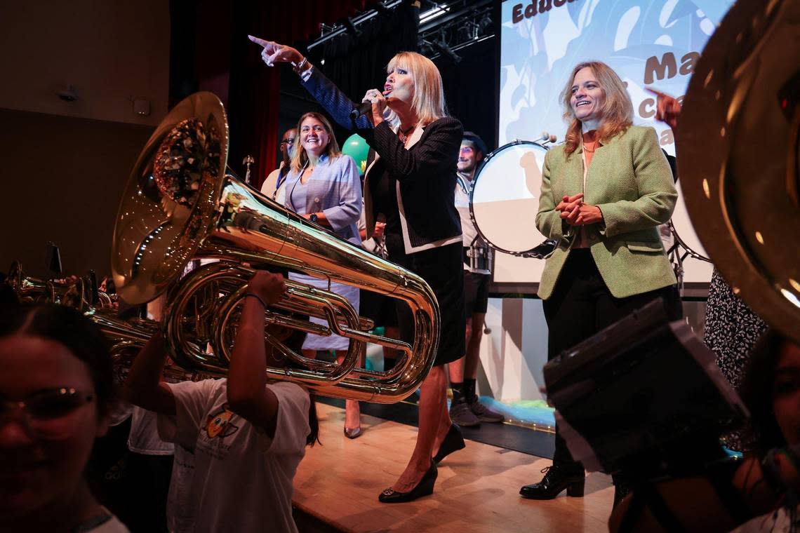 School Board of Miami-Dade County Chair Ms. Mari Tere Rojas, center, leads the audience of about 450 new teachers in a cheer as the high school’s band performed at the New Teacher Orientation at Hialeah Gardens Senior High on Monday, August 7, 2023. Carl Juste/cjuste@miamiherald.com