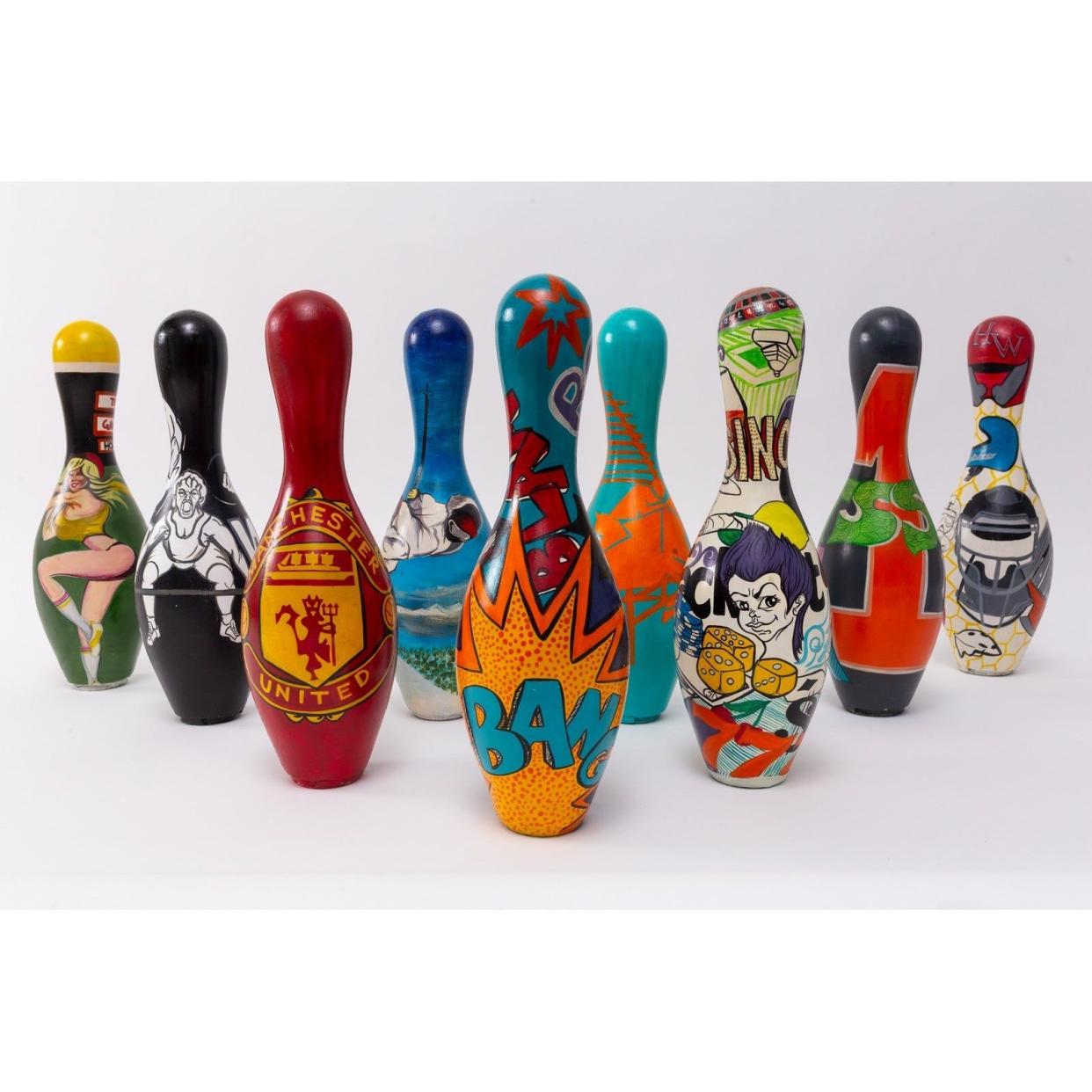 Decorated bowling pins from a former year's Pin and Ink Art Showcase.