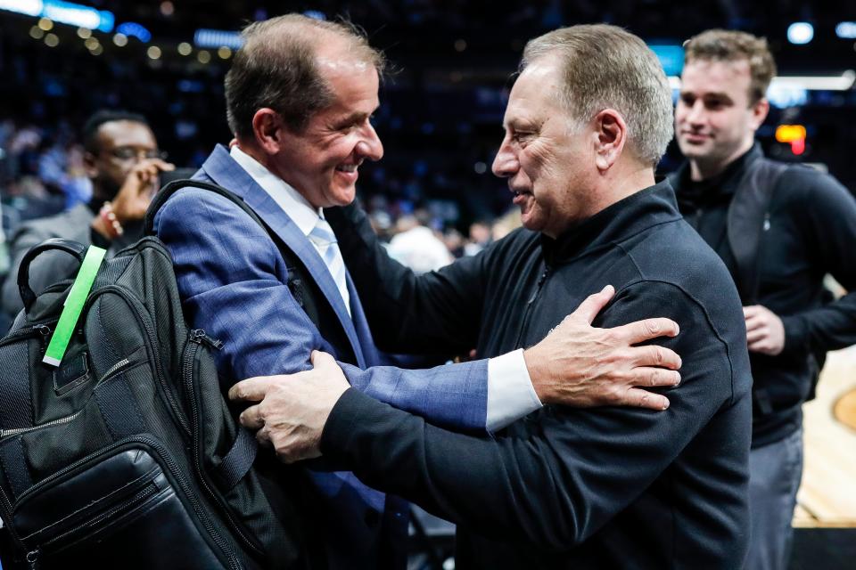 Michigan State head coach Tom Izzo hugs ACC commissioner James J. Phillips after 69-51 win over Mississippi State at the NCAA tournament West Region first round at Spectrum Center in Charlotte, N.C. on Thursday, March 21, 2024.