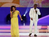 Brazilian singers Vanessa de Mata (L) and Alexandre Pires perform during the draw for the 2014 World Cup at the Costa do Sauipe resort in Sao Joao da Mata, Bahia state, December 6, 2013. REUTERS/Sergio Moraes