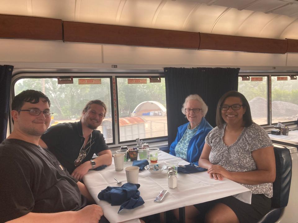 Tawney Beans sits with two groups of strangers, Matt, Ryan and Sherron, during her first dinner on Amtrak's Empire Builder.