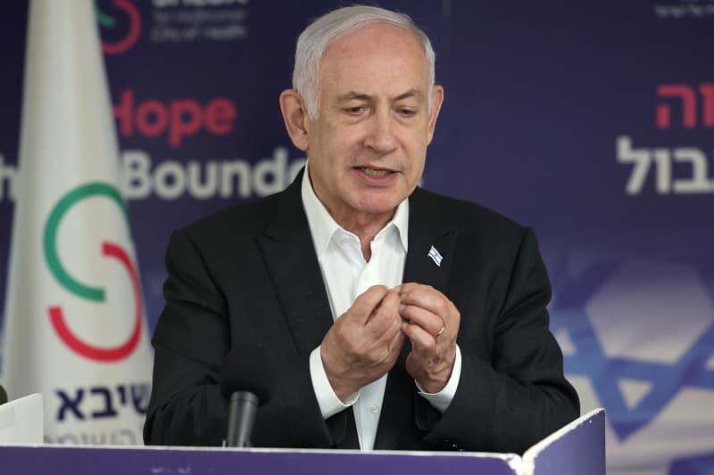 Israeli Prime Minister Benjamin Netanyahu speaks during a press conference at the Sheba Tel-HaShomer Medical Centre, in Ramat Gan. The Israeli Defense Forces (IDF) had rescued four Israeli hostages on Saturday in a "complex special daytime operation" in Nuseirat, a refugee camp in the central Gaza Strip. Jack Guez/AFP pool/dpa