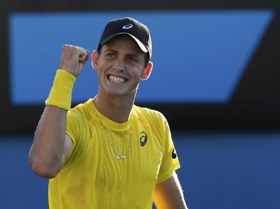 Vasek Pospisil of Canada celebrates defeating Samuel Groth of Australia during their men's singles match at the Australian Open 2014 tennis tournament in Melbourne January 13, 2014. REUTERS/Bobby Yip (AUSTRALIA - Tags: SPORT TENNIS)