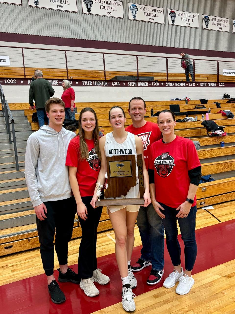 Payne family members take a picture after NorthWood girls basketball's regional win Saturday, Feb. 10, 2024, at Jimtown High School. Pictured, from left: JJ, Maddy, Claire, John and Dawn. Not pictured is the youngest child, Reid.