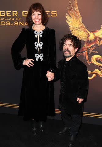 <p>Dia Dipasupil/Getty</p> Erica Schmidt and Peter Dinklage attend "The Hunger Games: The Ballad Of Songbirds & Snakes" on November 15, 2023 in New York City.