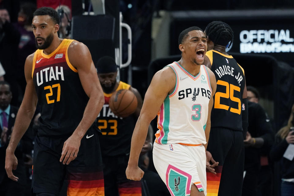 San Antonio Spurs forward Keldon Johnson (3) celebrates a basket against the Utah Jazz during the second half of an NBA basketball game, Friday, March 11, 2022, in San Antonio. (AP Photo/Eric Gay)