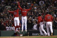 Boston Red Sox's Kyle Schwarber (18) celebrates a grand slam home run against the Houston Astros during the second inning in Game 3 of baseball's American League Championship Series Monday, Oct. 18, 2021, in Boston. (AP Photo/Winslow Townson)
