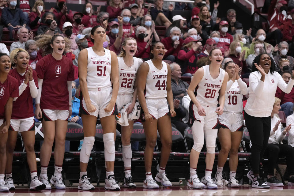 Stanford players celebrate after a 3-point basket against Arizona during the second half of an NCAA college basketball game Monday, Jan. 2, 2023, in Stanford, Calif. (AP Photo/Tony Avelar)