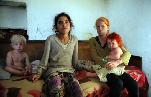 A picture taken on October 24, 2013, shows four of the children of Sasha Ruseva and Atanas Rusev in the Roma district of the central Bulgarian town of Nikolaevo