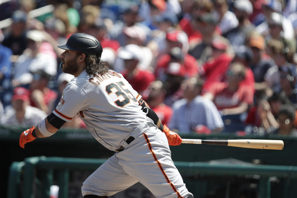 San Francisco Giants Brandon Crawford follows through on a double during the first inning of an MLB baseball game, Sunday, April 24, 2022, in Washington. (AP Photo/Luis M. Alvarez)