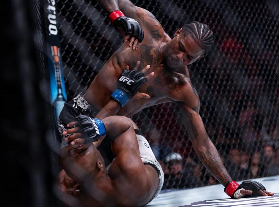 Kevin Holland of the United States fights against Michael Page of England during their welterweight title match during the UFC 299 event at the Kaseya Center on Saturday, March 9, 2024, in downtown Miami, Fla.