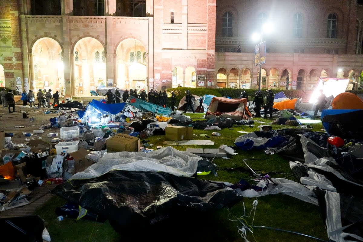 Police break up an encampment on the UCLA campus on Thursday (AP)