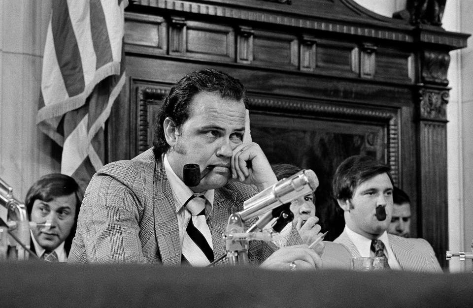 Sen. Fred Thompson listens to questions during the Senate Watergate Committee hearings in Washington, July 11, 1973. Others are unidentified. Thompson wound up being the one who publicly asked Nixon aide Alexander Butterfield whether there were any listening devices in the White House. 