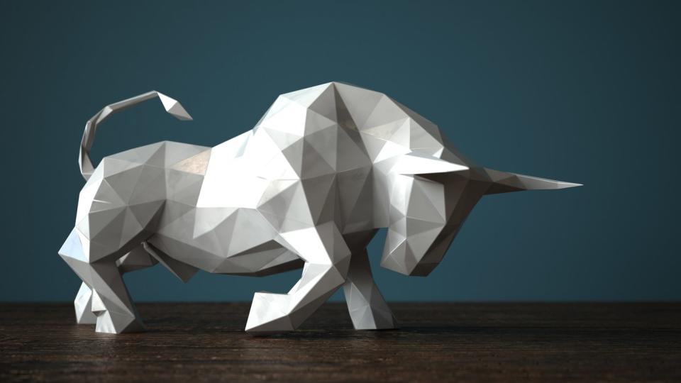 Origami figure of a charging bull.