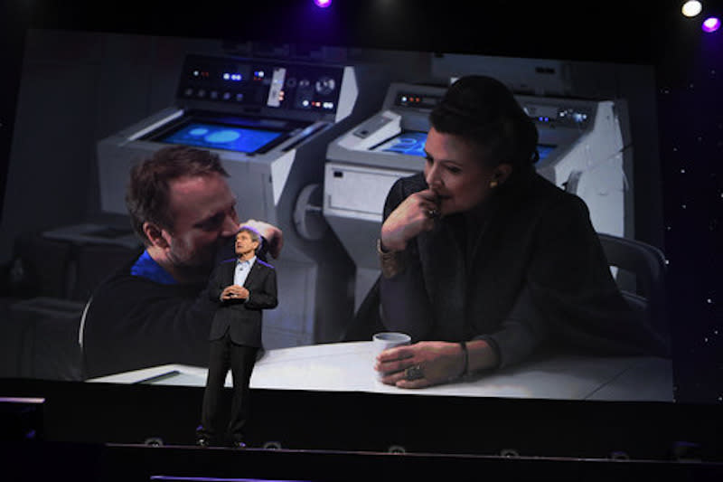 <p>Rian Johnson and Carrie Fisher provide the backdrop to Walt Disney Studios Chairman Alan Horn’s introduction to the presentation. (Photo: Disney/Image Group LA) </p>